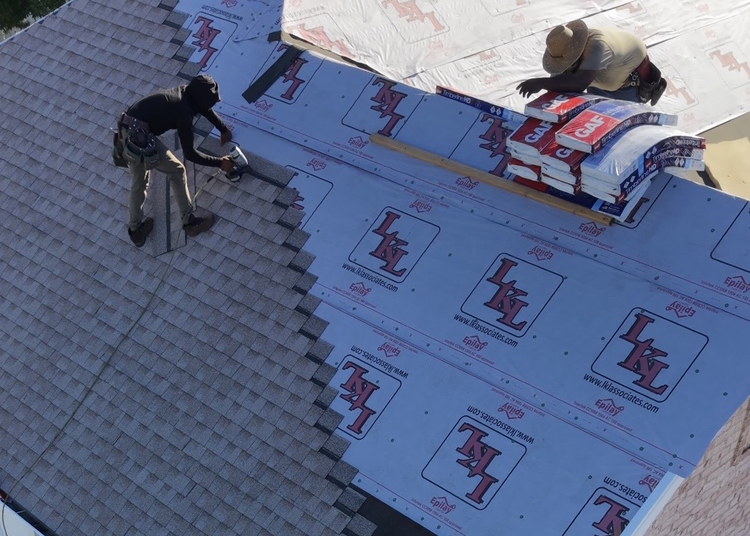 DFNDR Roofing crew installing asphalt shingles on a home in Highland, Utah