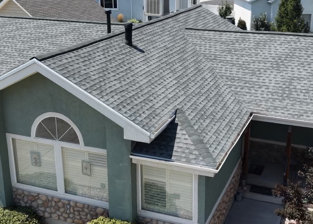 Aerial view of a finished shingle roof replacement on a home in Lehi, Utah